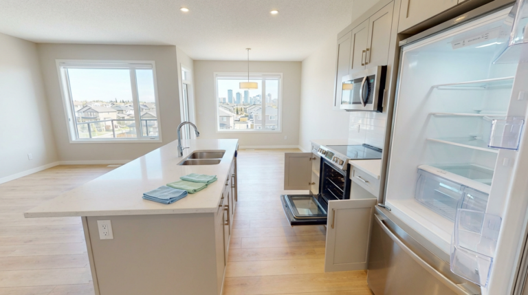 Move-in/Move-out Cleaning Services in Calgary showing an empty home cleaned and ready for inspection with spotless kitchen and appliances.
