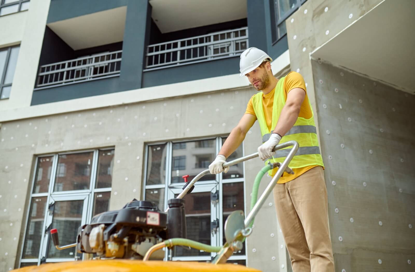 Man cleaning hardwood floors with an agitator.