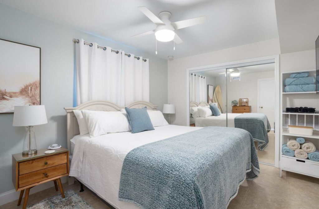 Bedroom of a nicely organized airbnb rental property.