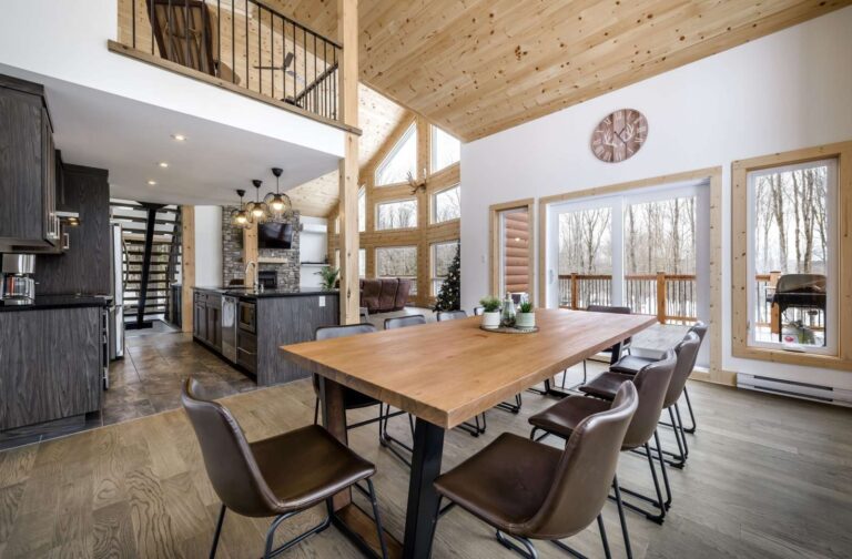 Dining and kitchen area of a cabin style airbnb rental property.